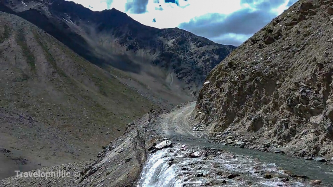 Treacherous roads running over glacial water flowing 